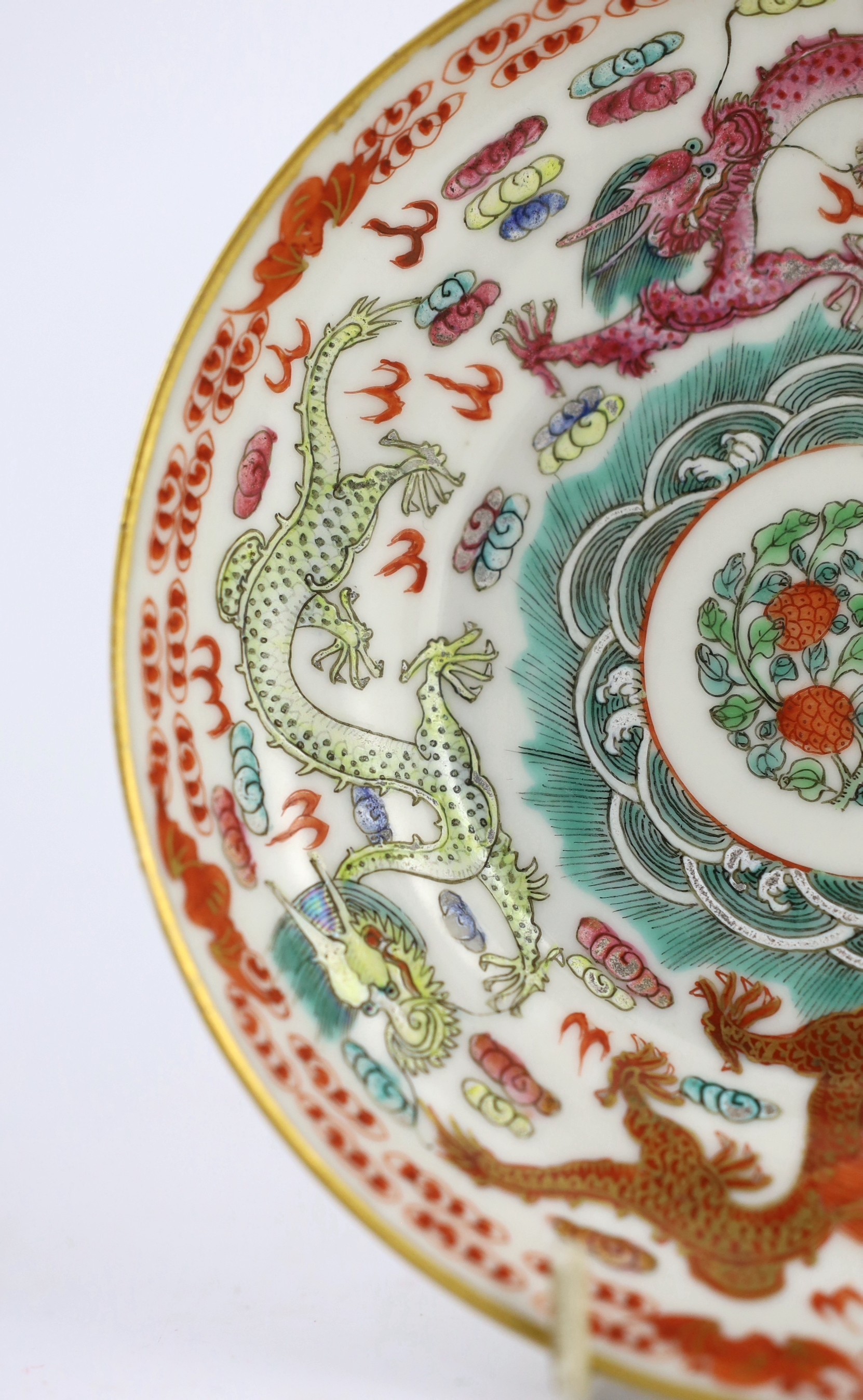 A Chinese famille rose fencai ‘dragon’ saucer dish, Jiaqing four character seal mark, 19th century, 14.6cm diameter